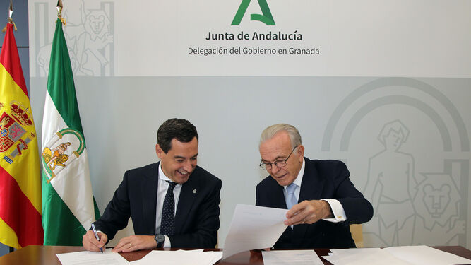 Moreno y Fainé, en la firma del convenio en Granada.